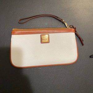 Dooney and Burke Wristlet classic cream color. Perfect for all occasions!